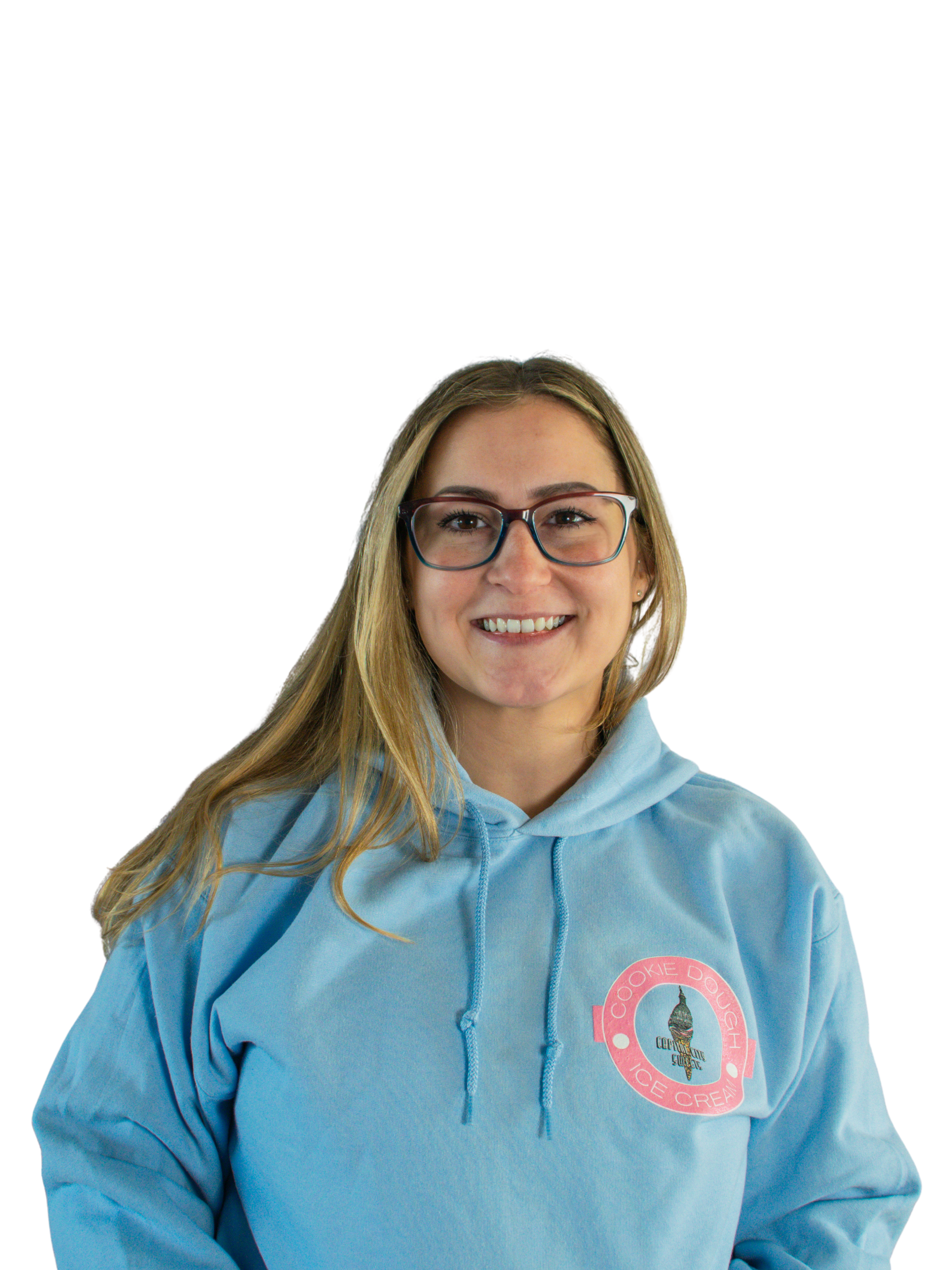 A woman wearing glasses and a blue shirt is smiling.