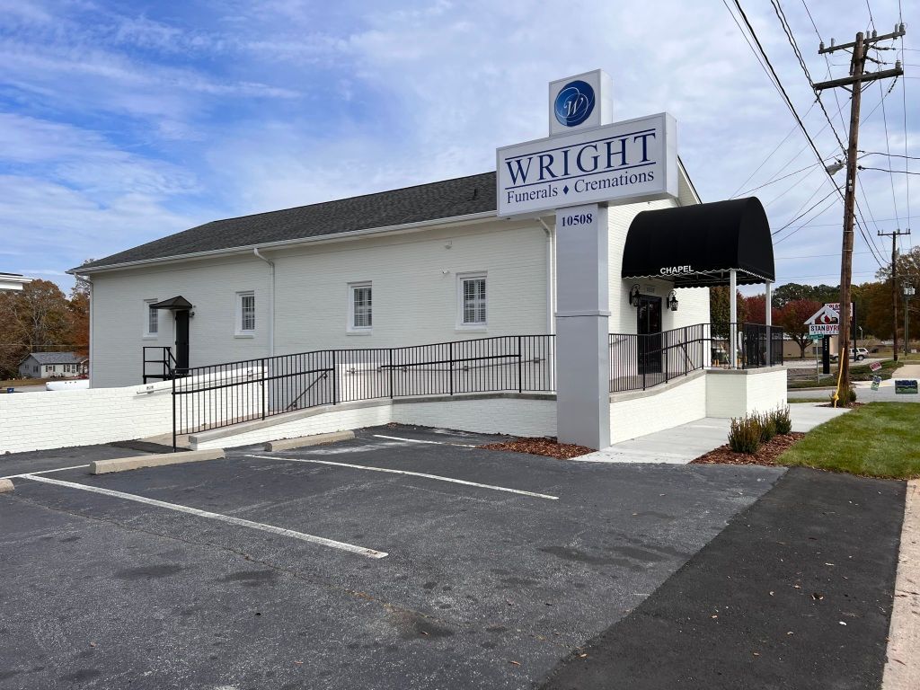 A white building with a sign that says wright on it.
