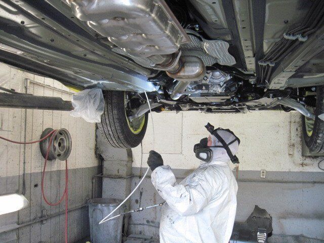 Man Spraying The Rust — North Clarendon, VT — Byrnes Rust Proofing Center