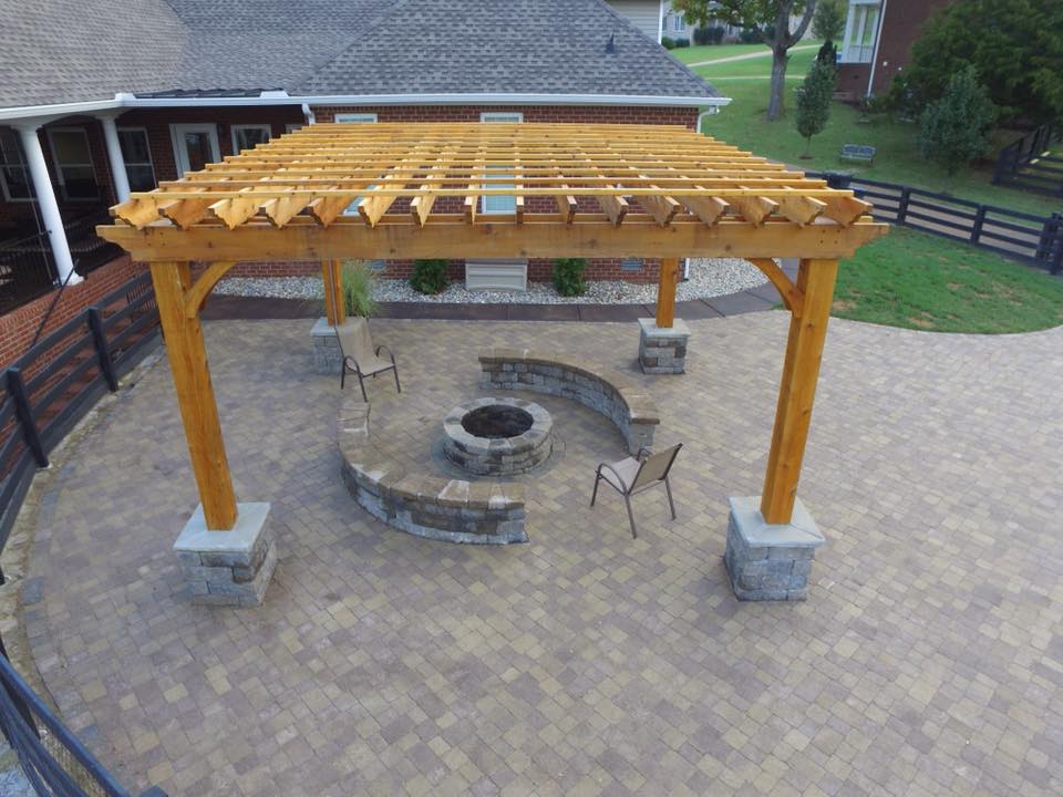stone patio with new pergola and firepit