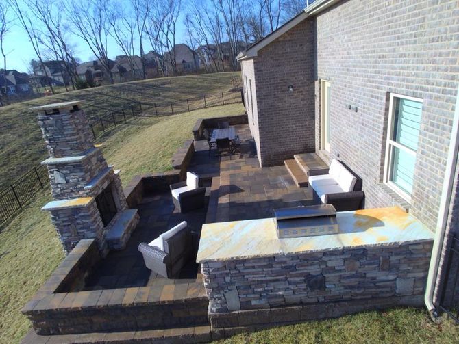 Outdoor Stone Kitchen Area with Stone Slab Marble Countertops