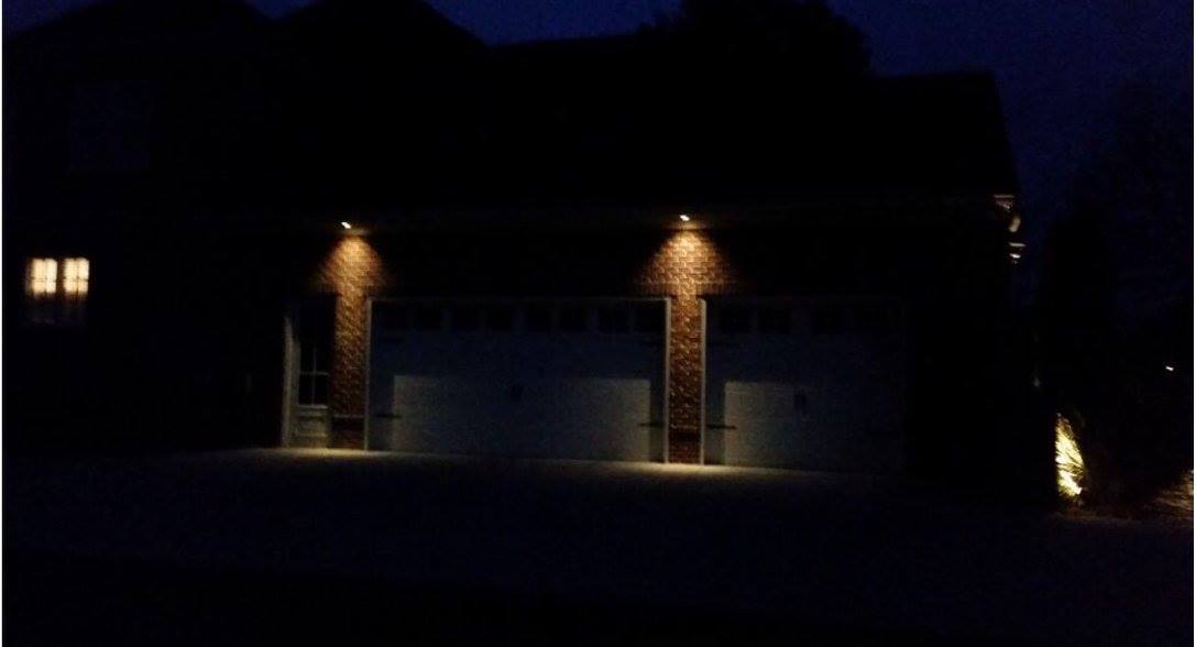 outdoor lighting newly installed on garage doors