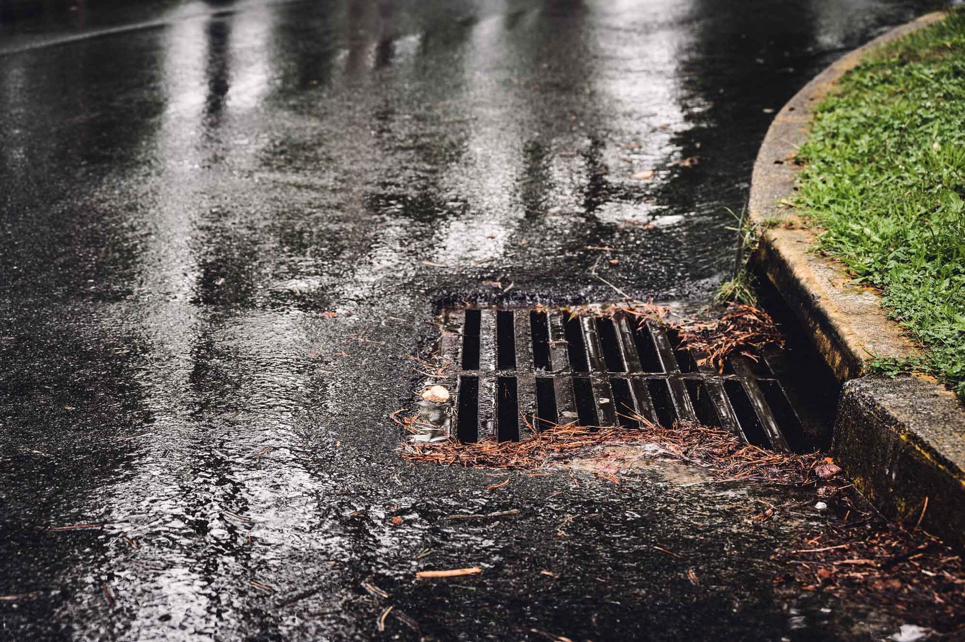 Metal storm drain during a rain event.