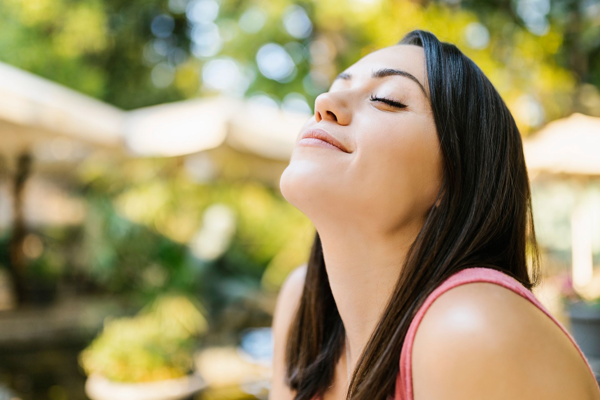 A happy woman able to breath after sinus surgery.