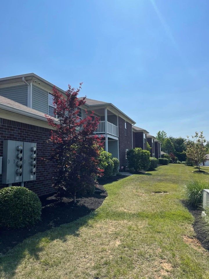 A row of apartment buildings with a lush green lawn in front of them – Mt. Washington, KY - Beck’s
