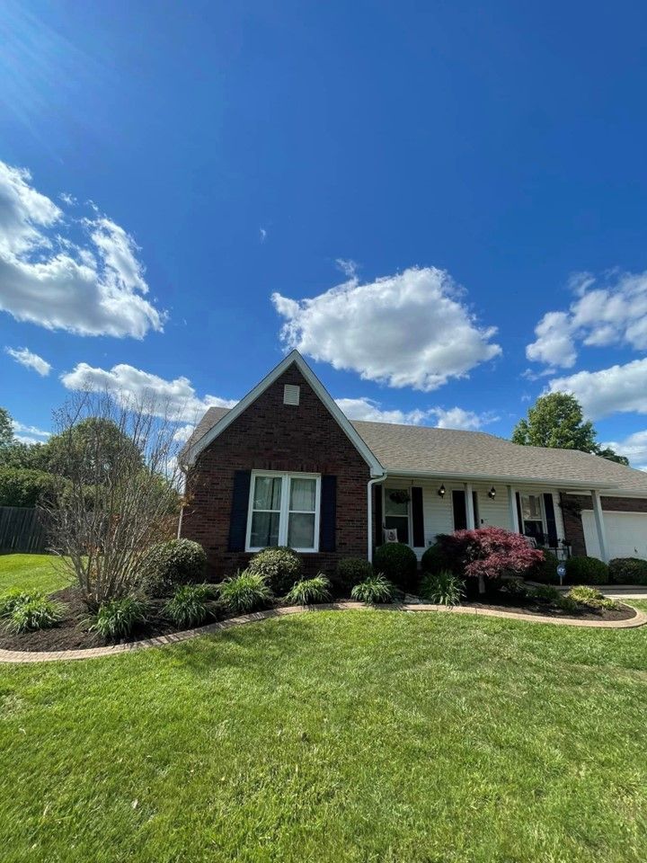 A brick house with a large lawn in front of it on a sunny day – Mt. Washington, KY - Beck’s