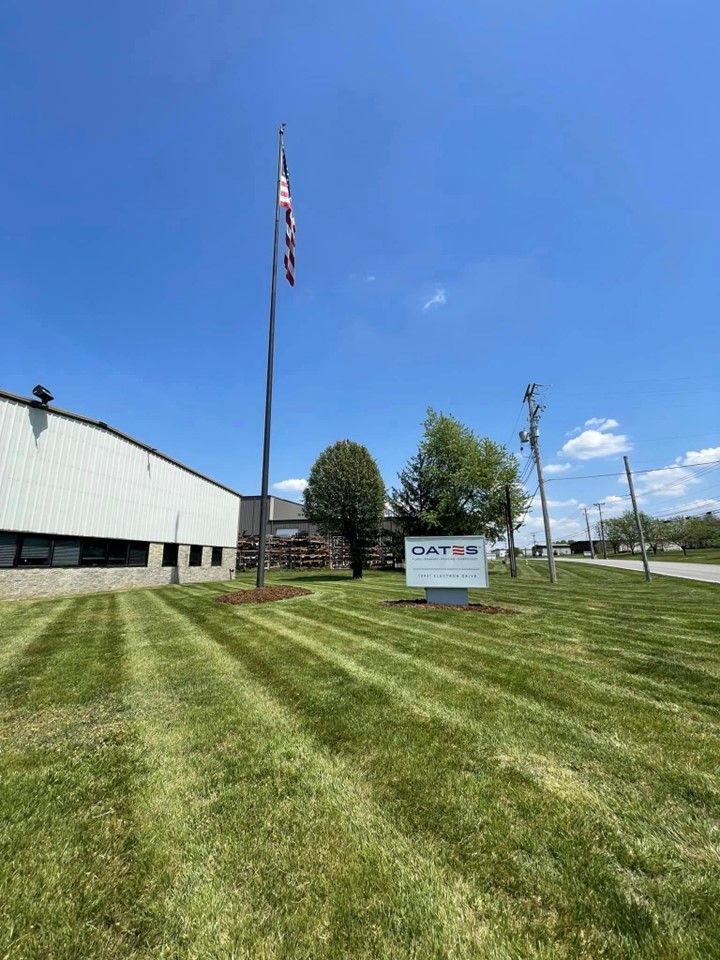 A large lawn in front of a building with a flag on a pole – Mt. Washington, KY - Beck’s