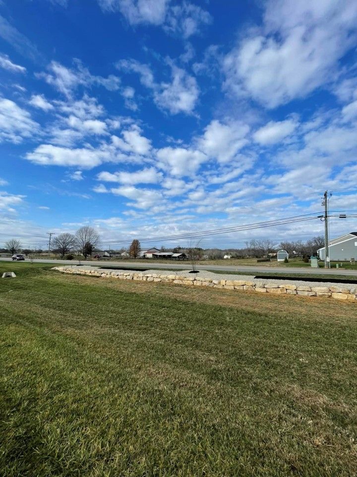 A large grassy field with a blue sky and clouds in the background – Mt. Washington, KY - Beck’s