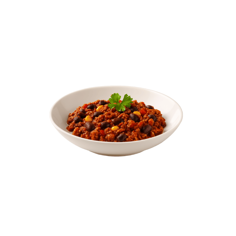 Een kom chili met zwarte bonen, maïs en peterselie als garnering.