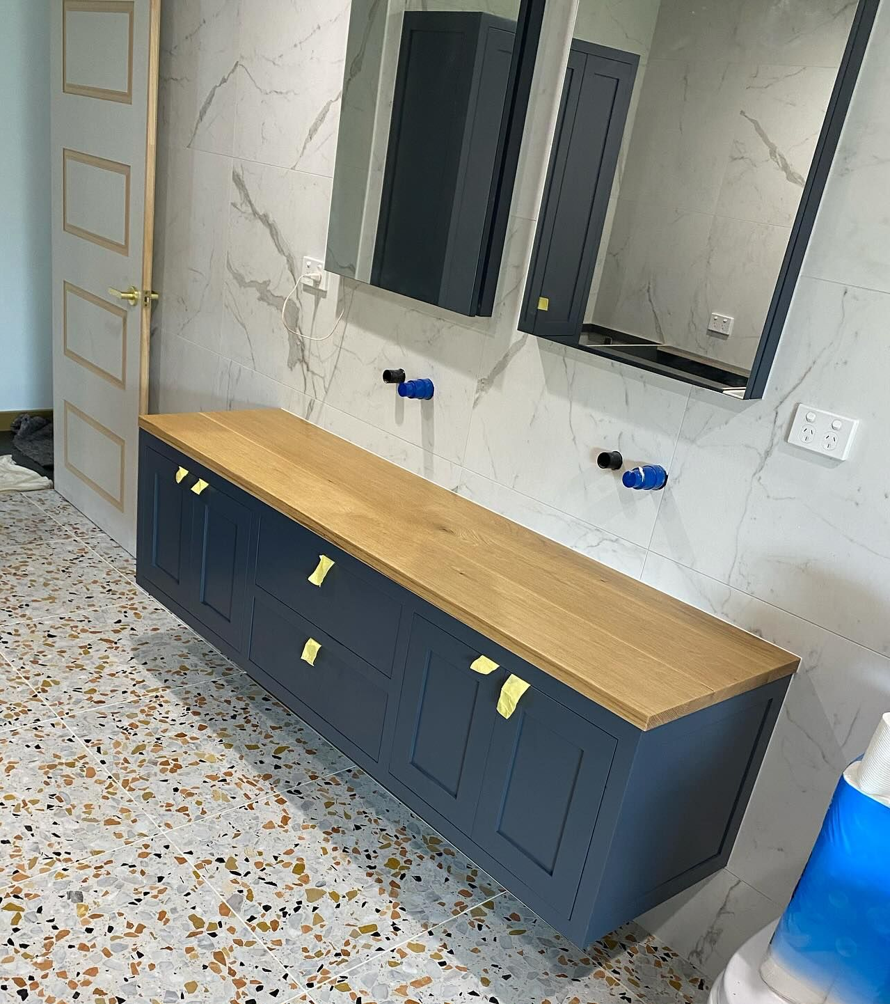 Wooden Floating Cabinet with An Open Drawer, Holding a Green Towel. the Cabinet Is Topped — BC Customs in Newcastle, NSW