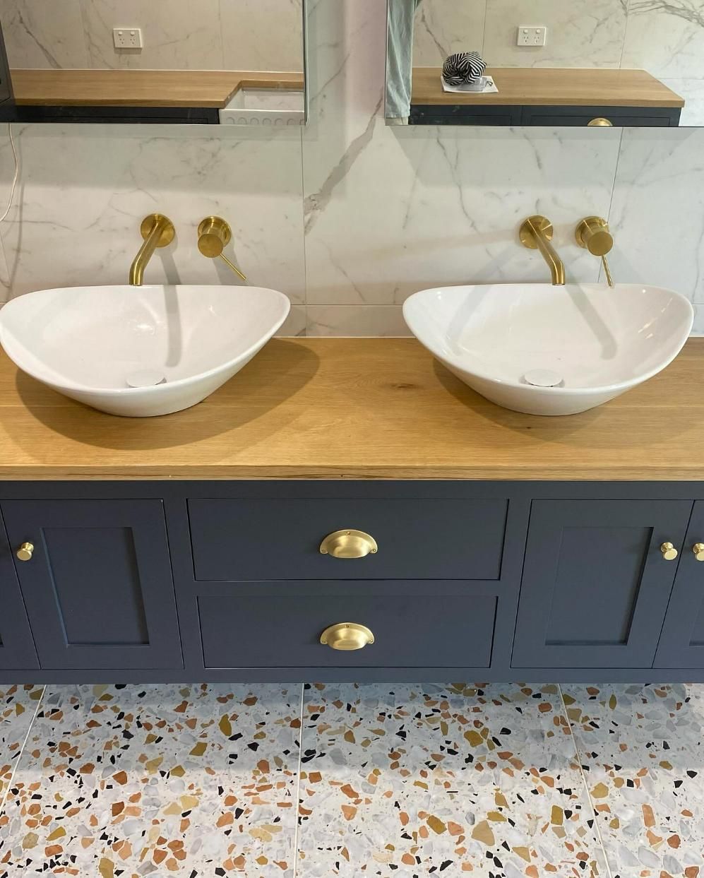 Double vanity in a bathroom with oval sinks, gold fixtures — BC Customs in Burrell Creek, NSW
