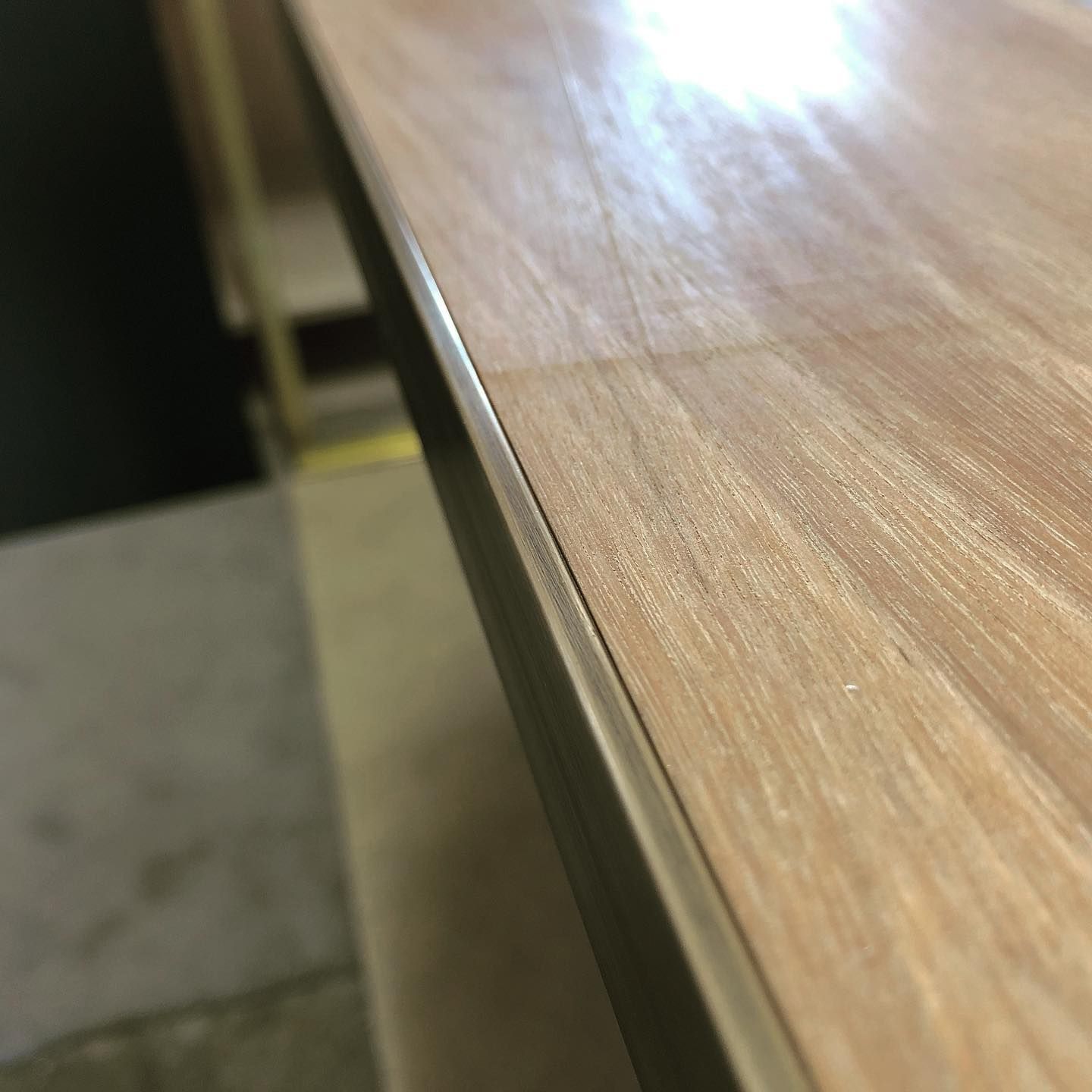 Close-Up Of Light-Colored Wooden Surface With Dark Metal Edge And Visible Wood Grain — BC Customs in Port Macquarie, NSW