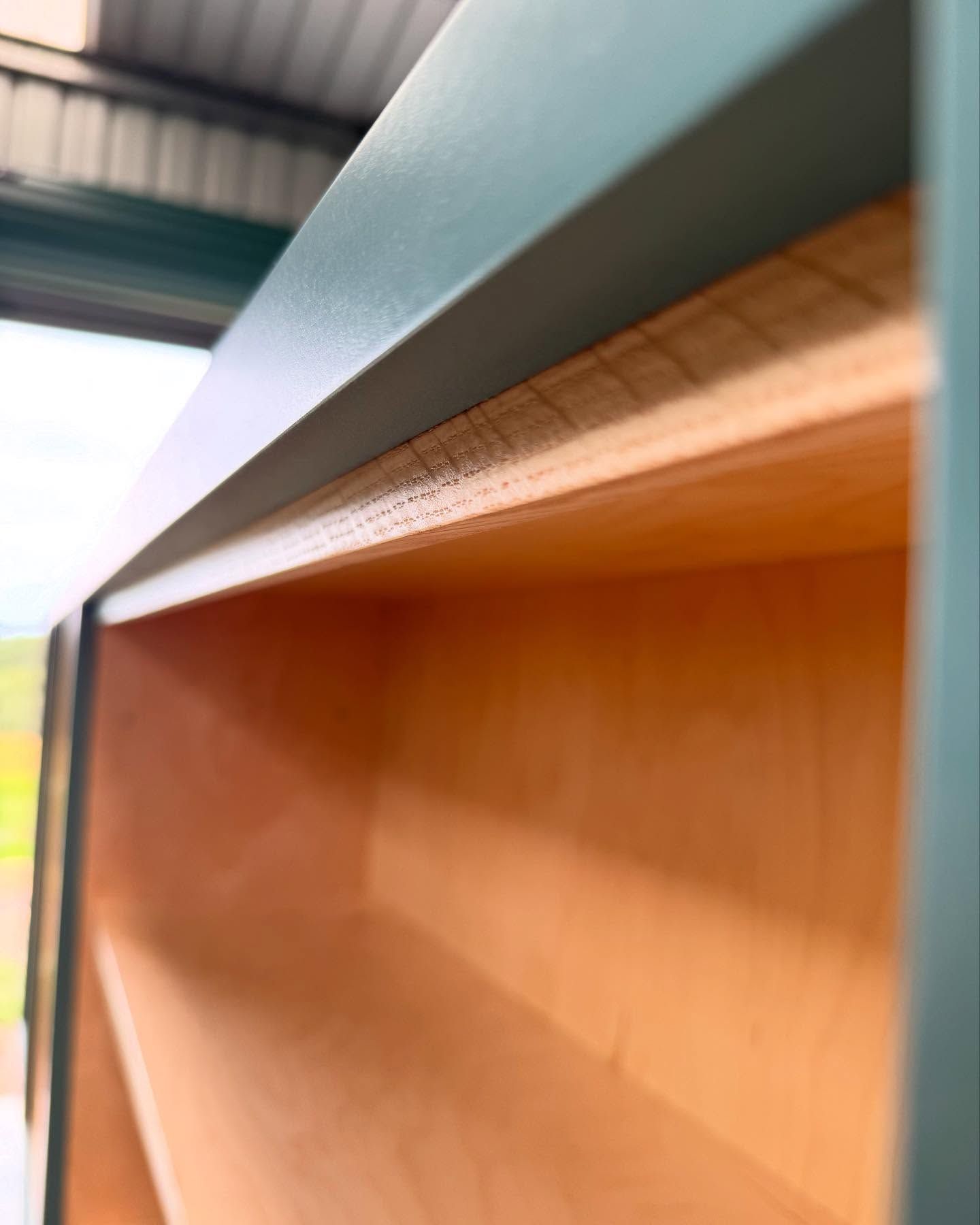Close-Up of A Teal-Painted Cabinet Interior, Revealing Natural Wood Shelving — BC Customs in Burrell Creek, NSW