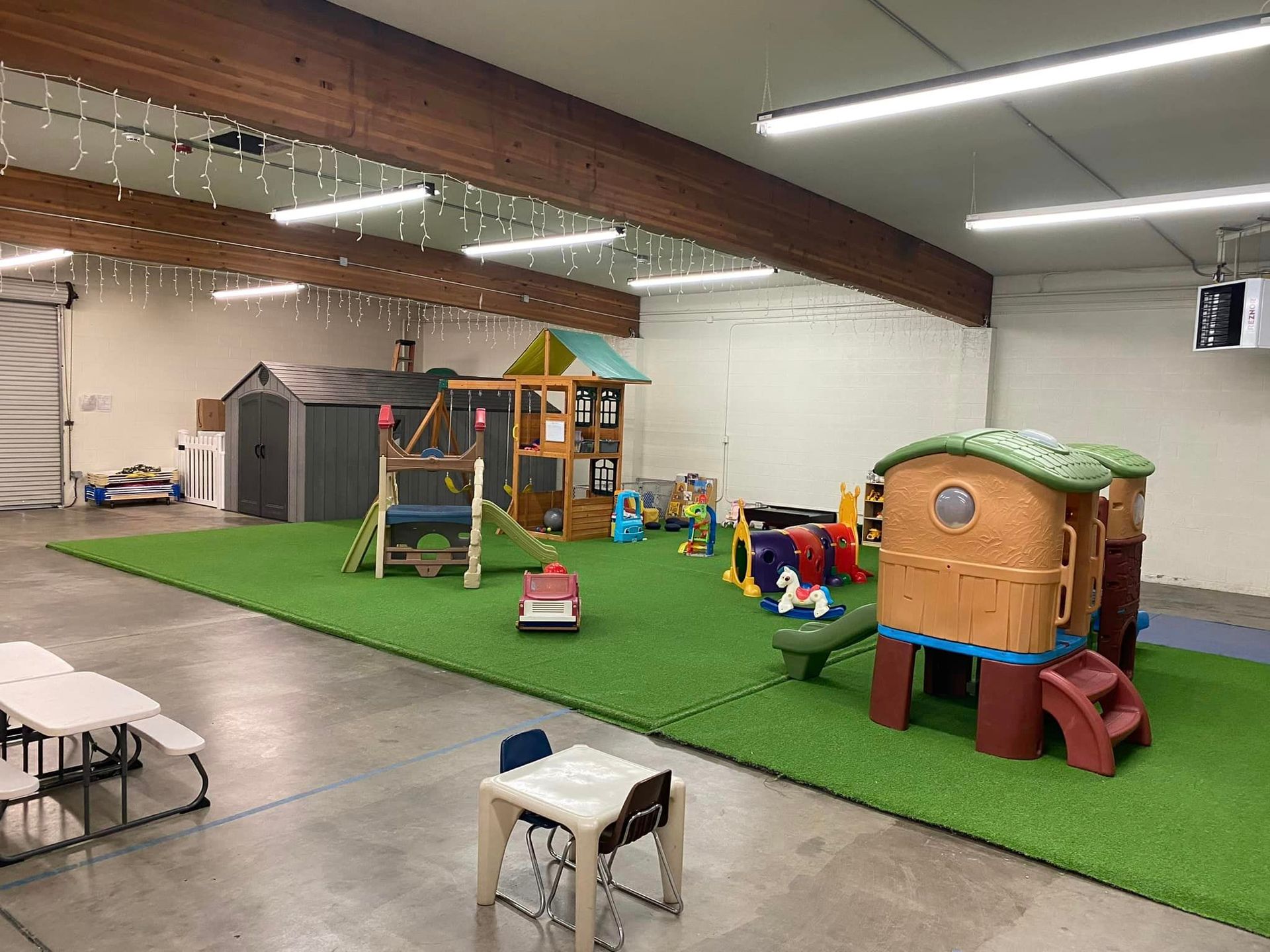 A Large Room with A Playground and Tables and Chairs – Oroville, CA – Aunt Sherrie's Preschool