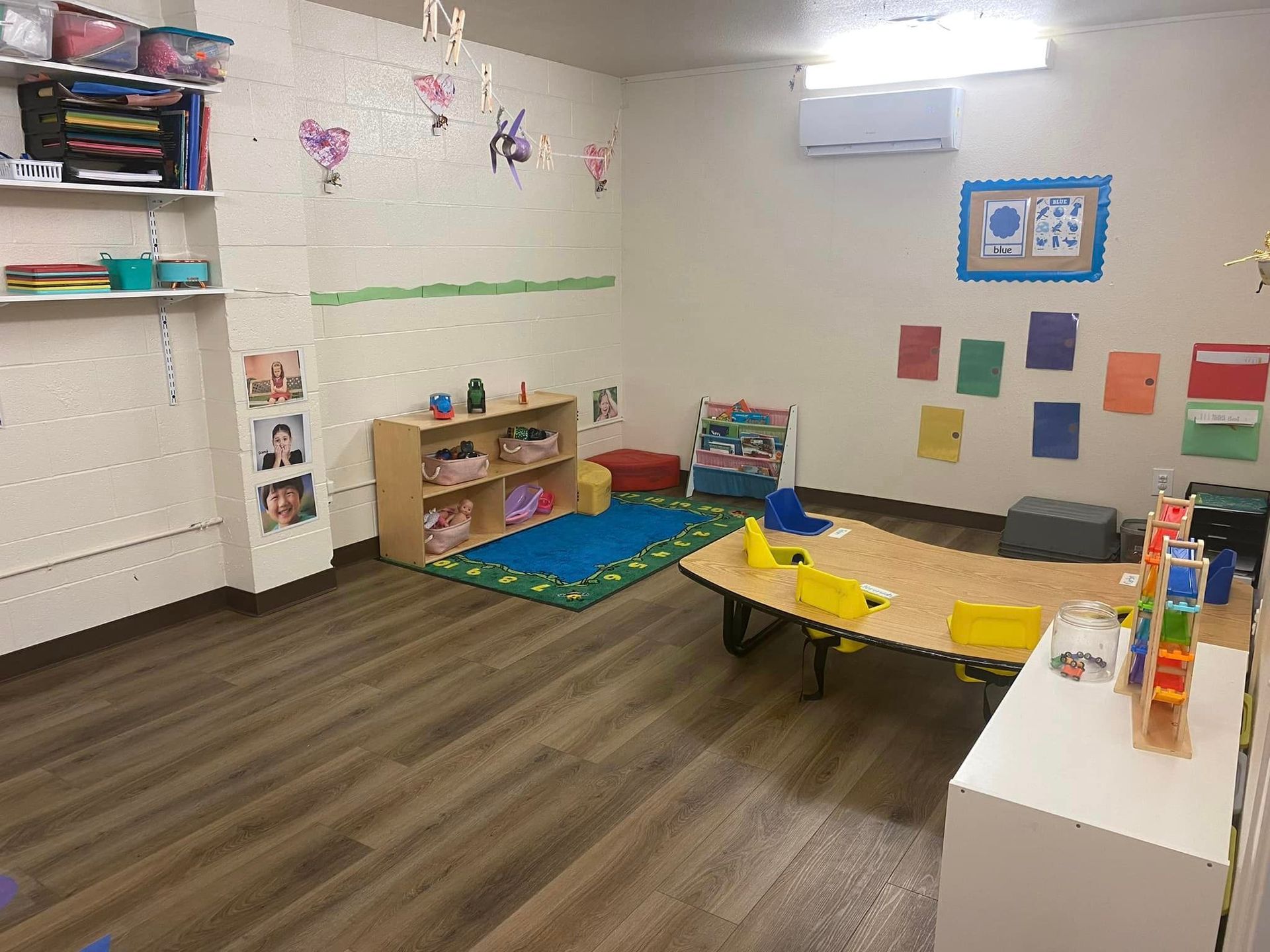 A Room with A Table , Shelves , and Toys in It – Oroville, CA – Aunt Sherrie's Preschool