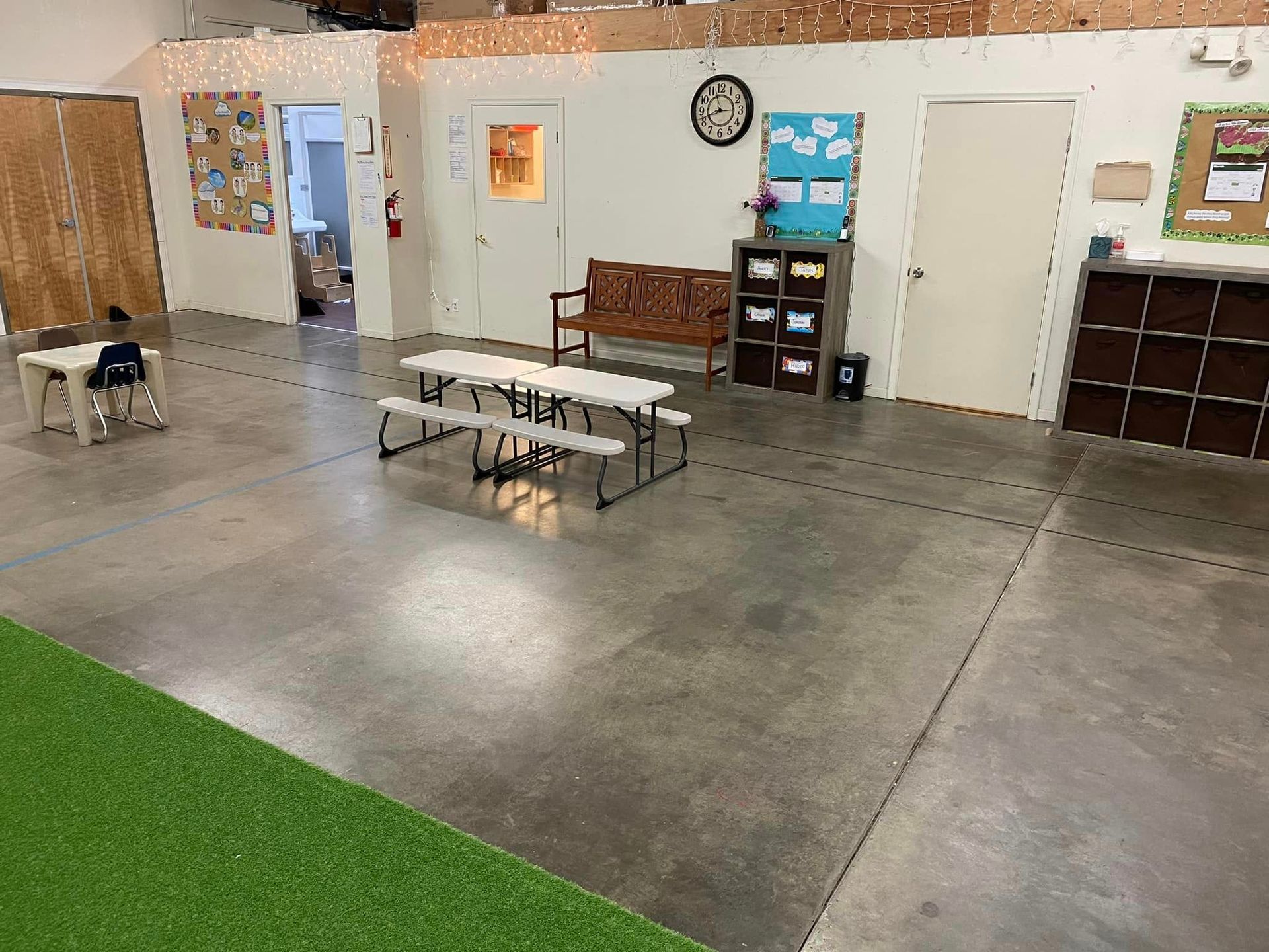 A Large Room with A Picnic Table and Benches in It – Oroville, CA – Aunt Sherrie's Preschool