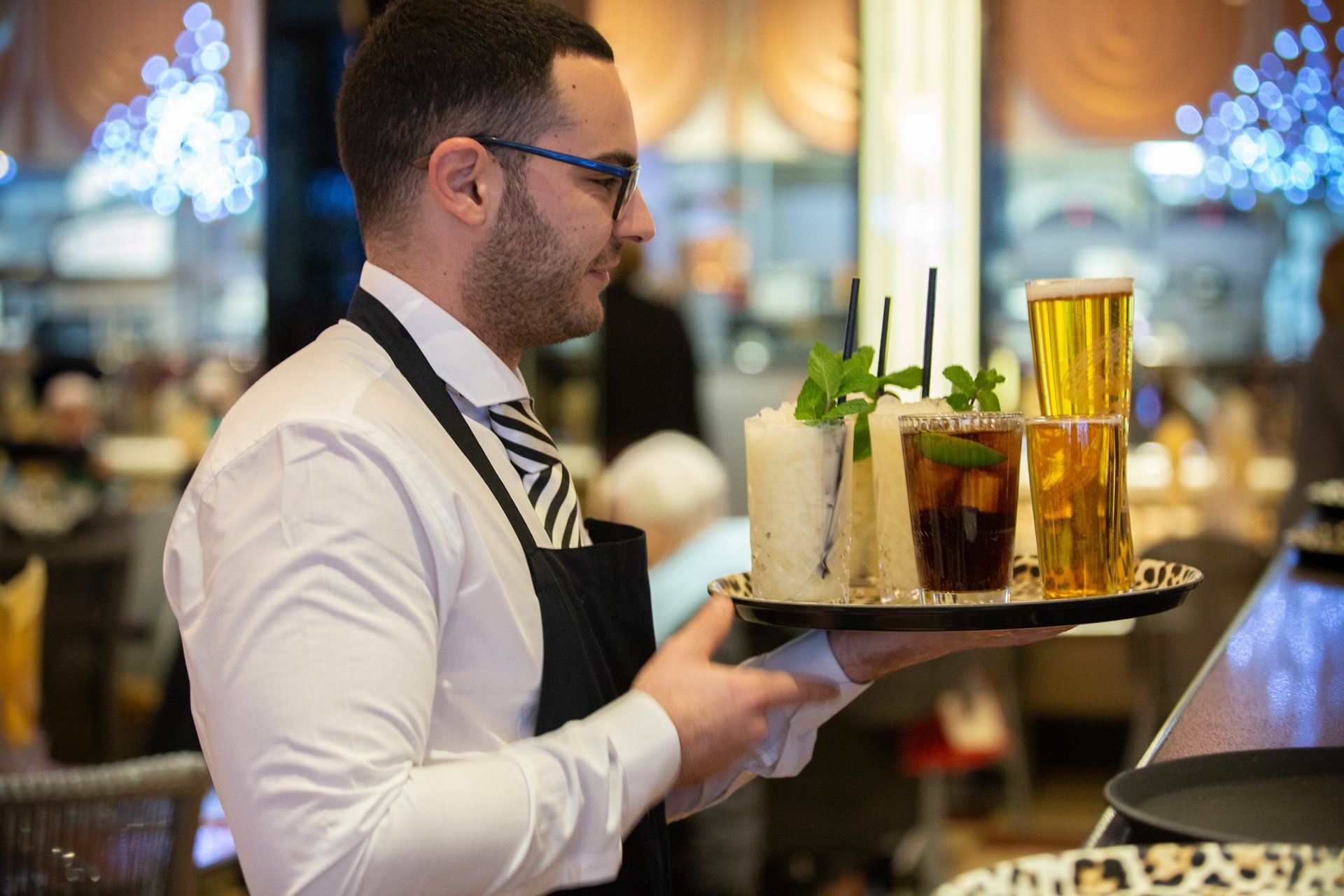 Event photo waiter with drinks at Bibis Restaurant  in Leeds