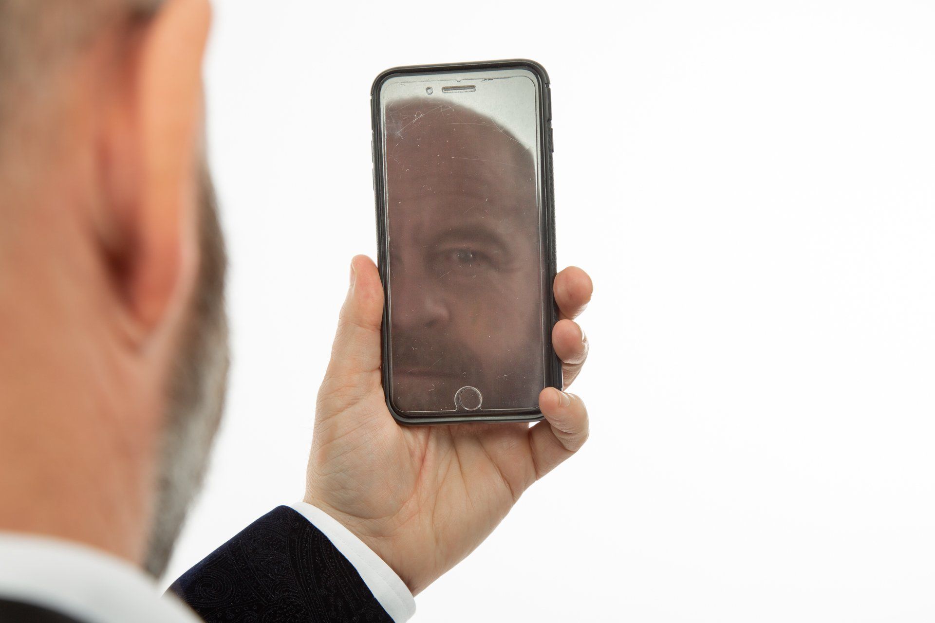 Emotipic of man wearing yellow waistcoat and holding mobile phone taken in Leeds Photography Studio