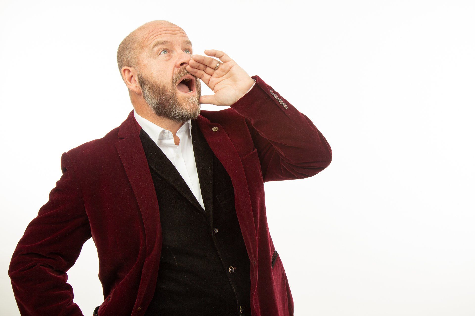 Emotipic of man wearing red jacket shouting out taken in Leeds Photography Studio