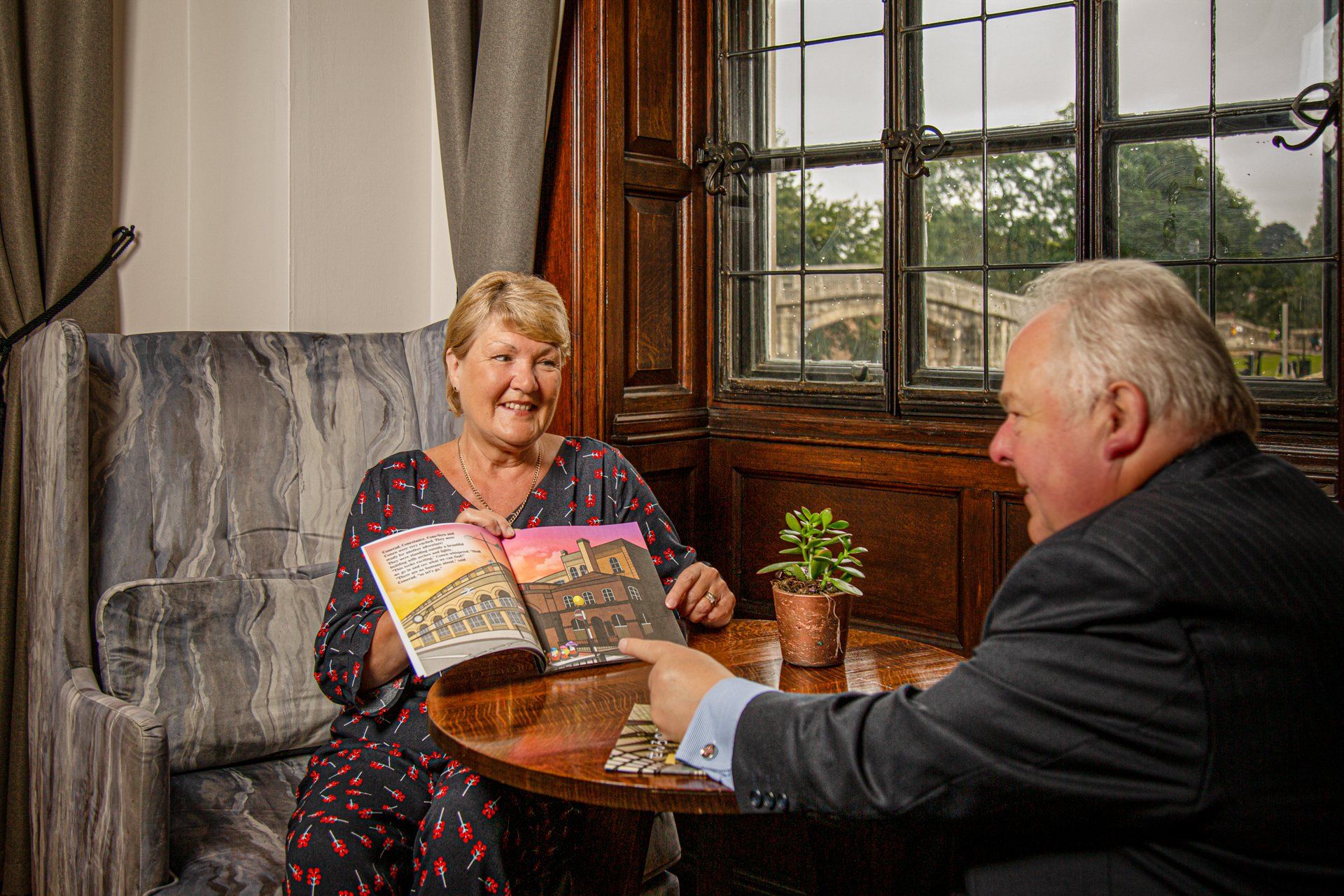 Mr Yorkshire and his author wife Chris reading a Cones book at The Grand Hotel, York