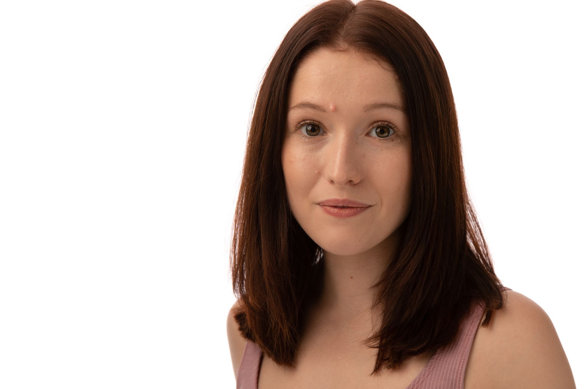 Headshot for brunette girl wearing a pink top.