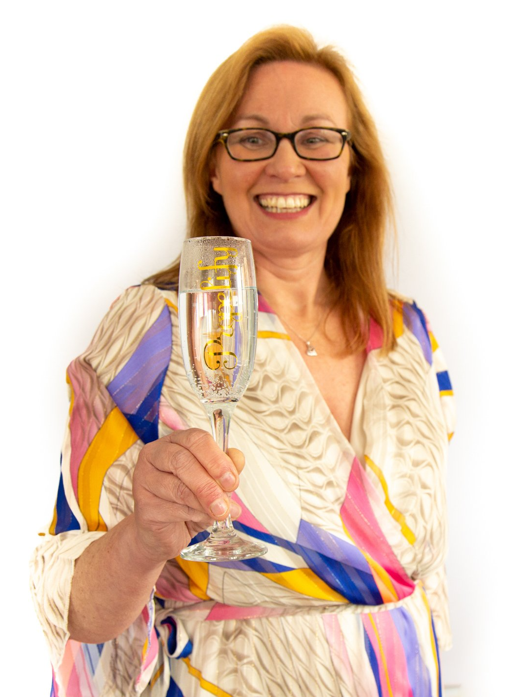 Emotipic of lady raising a glass of champagne captured in Roth Read Photography studio