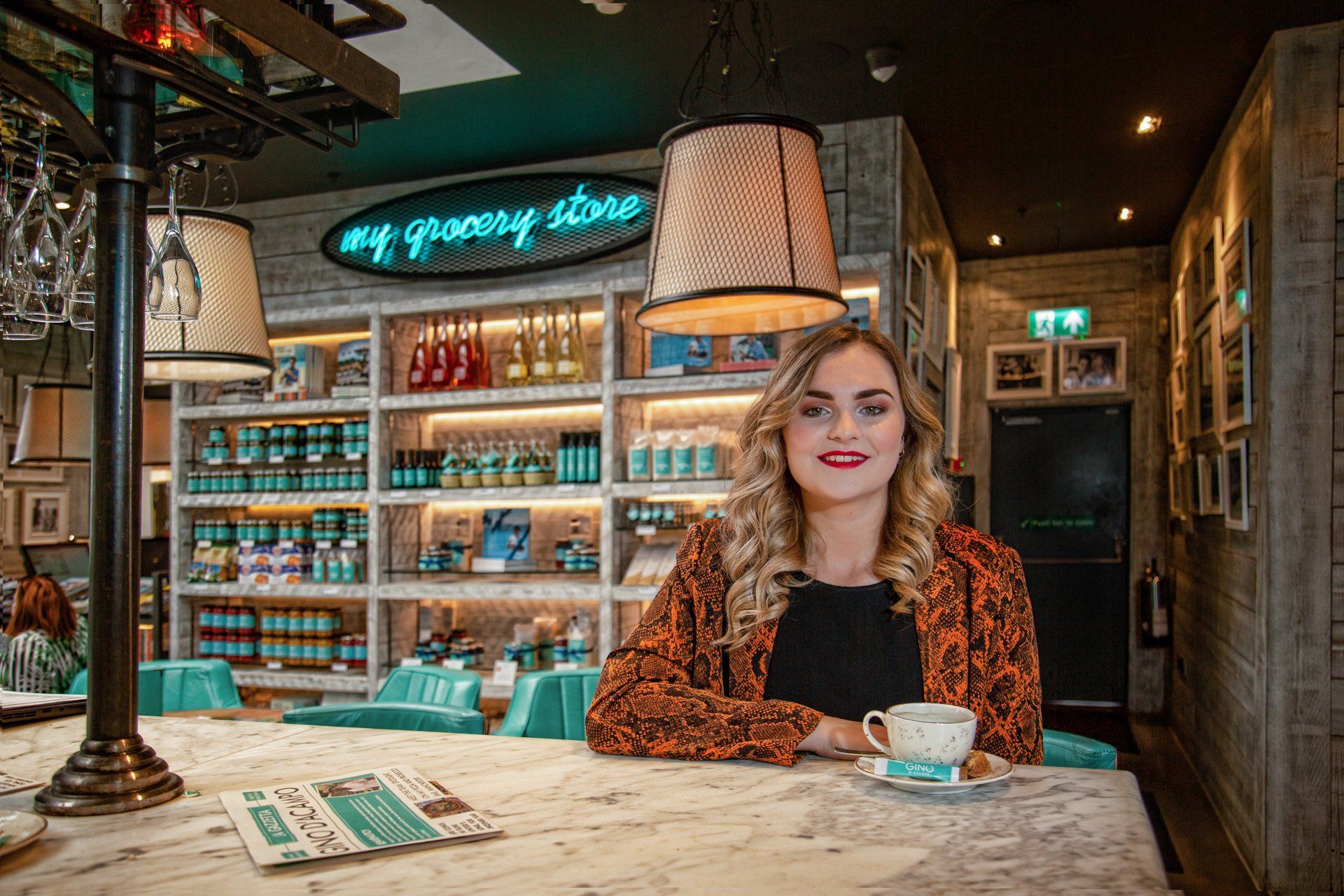Sales and Events Manager sitting at the bar of Gino D'Acampo's Restaurant, Hull