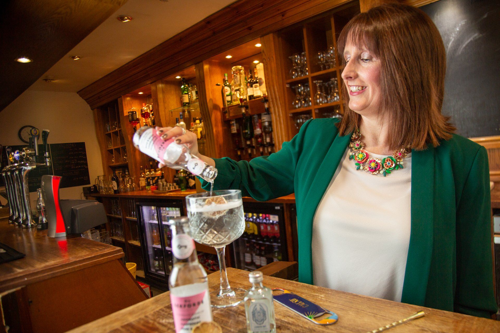 Commercial photography lady pouring a gin at  Warterton Park, Wakefield