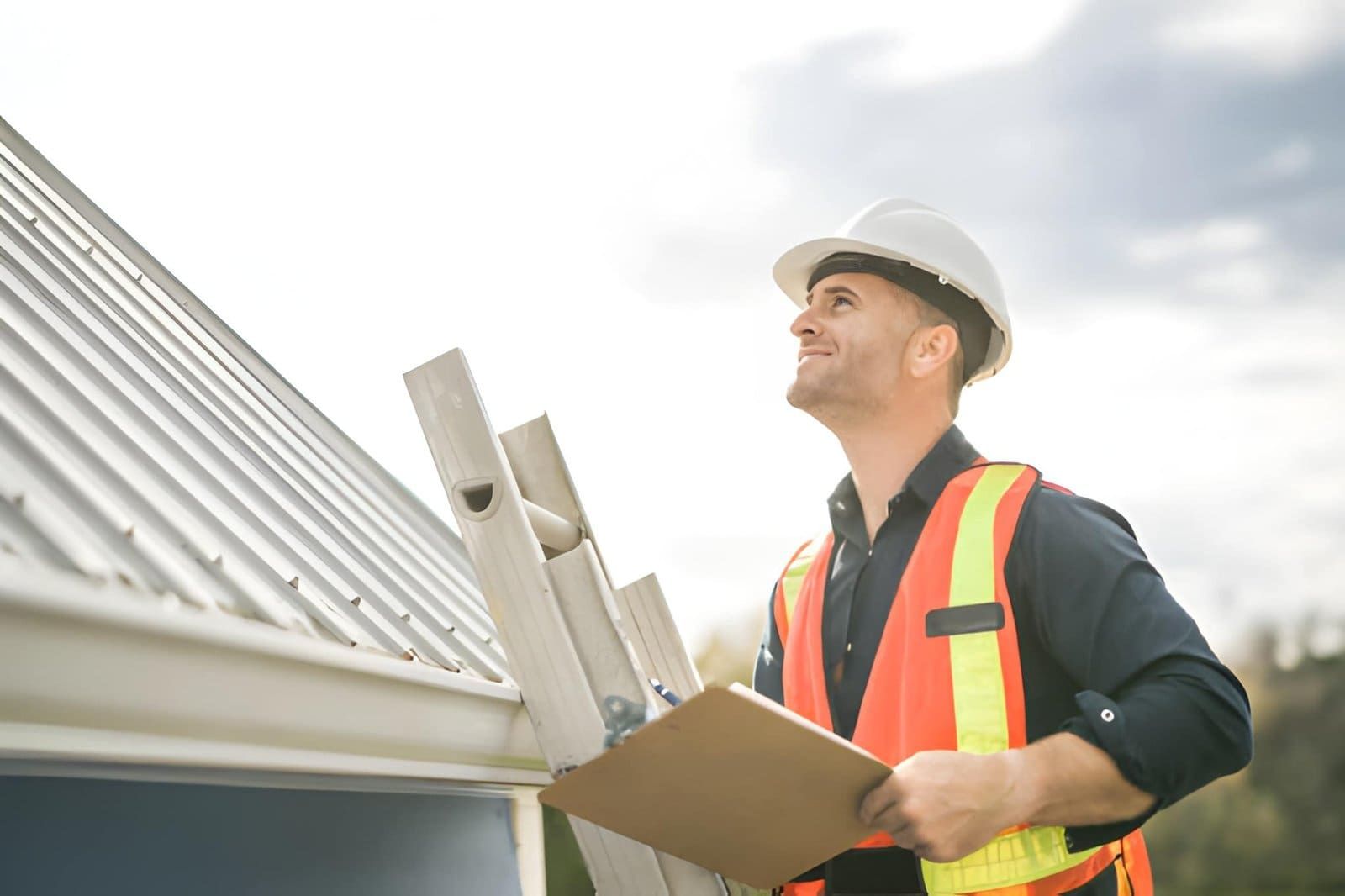 Home inspector Palm City FL—professional in safety gear examining roof with clipboard during property inspection.