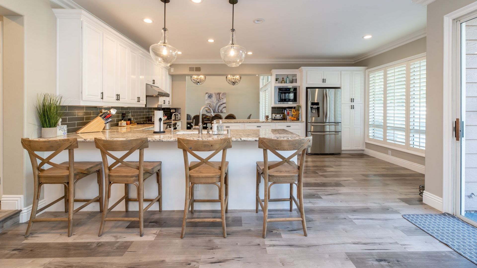 A bedroom with a bed , desk and computer.
