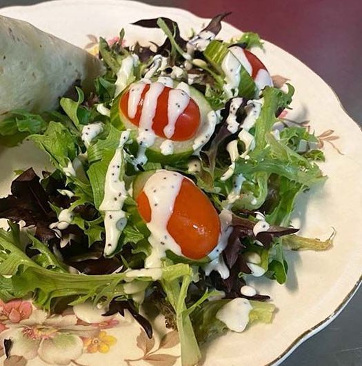 Fresh garden salad with poppy seed dressing.