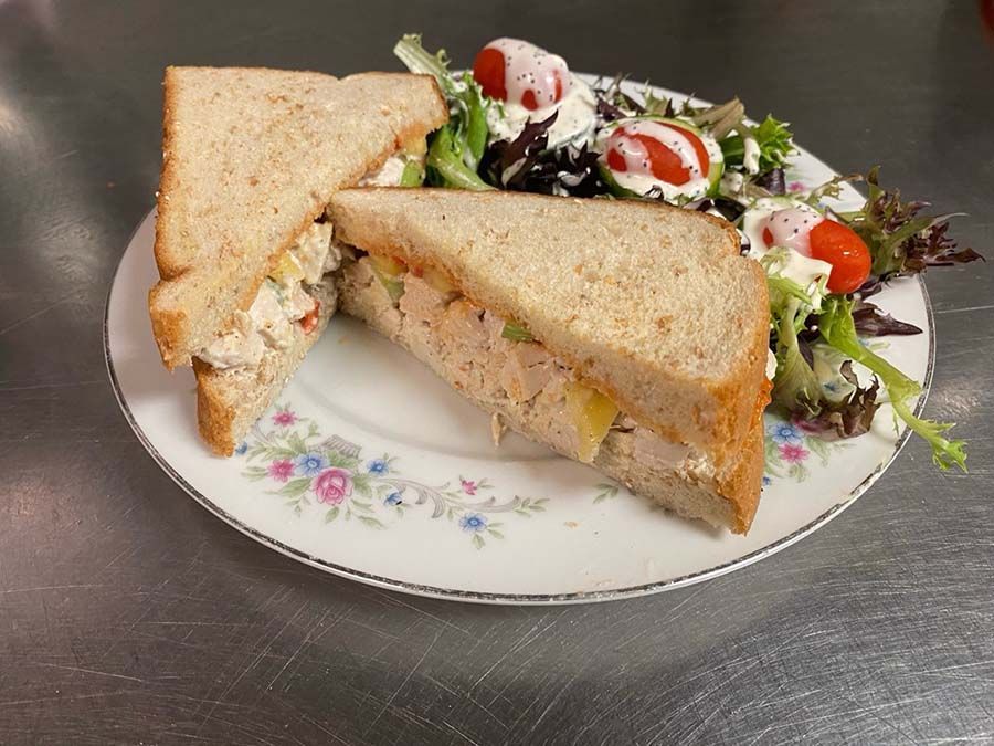 Hawaiian chicken salad sandwich and a salad.