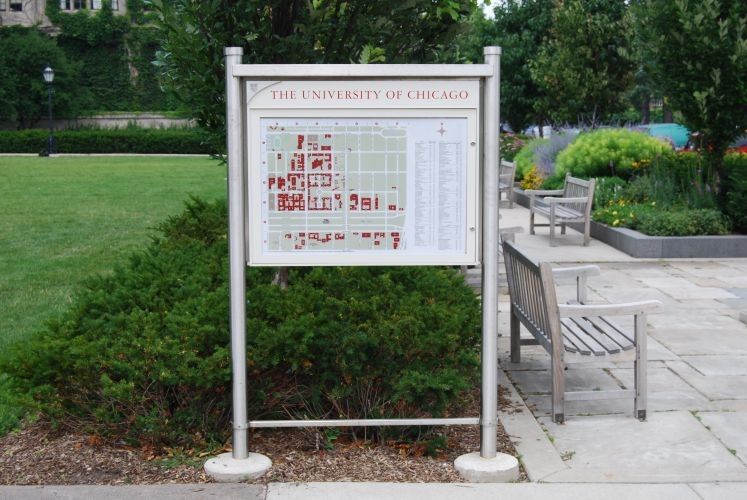 Sign with map of Chicago buildings in a park setting.