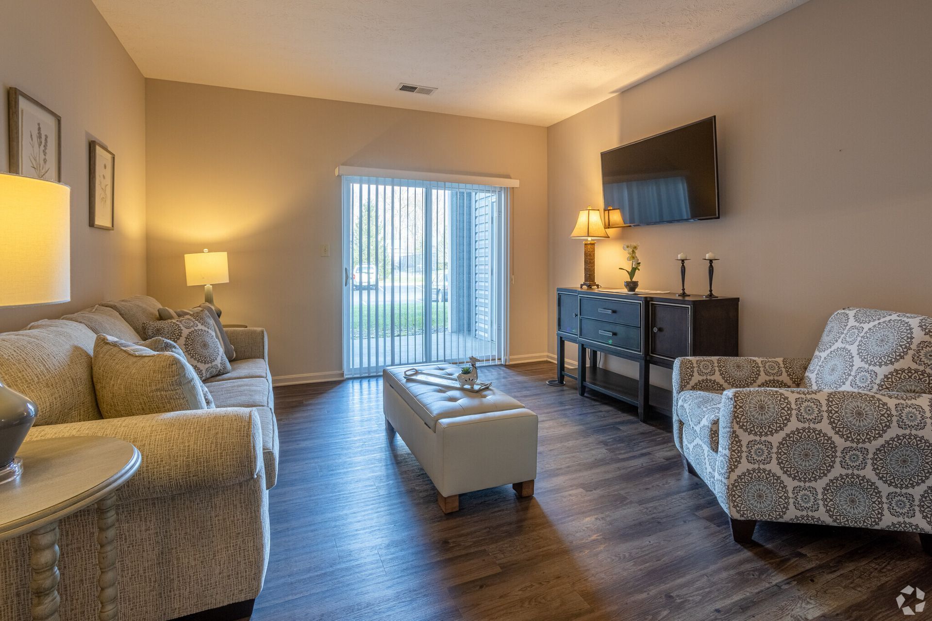 A living room filled with furniture and a flat screen tv.