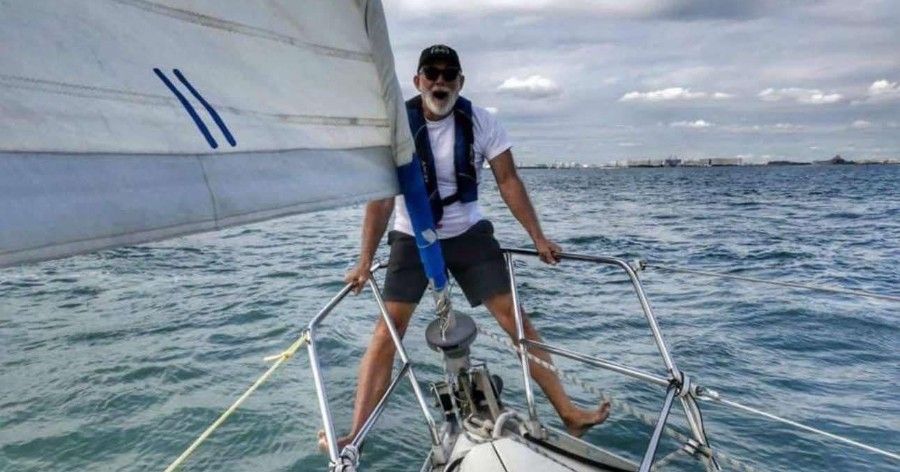 Lowell Sheppard aboard his boat Wahine on the open water.