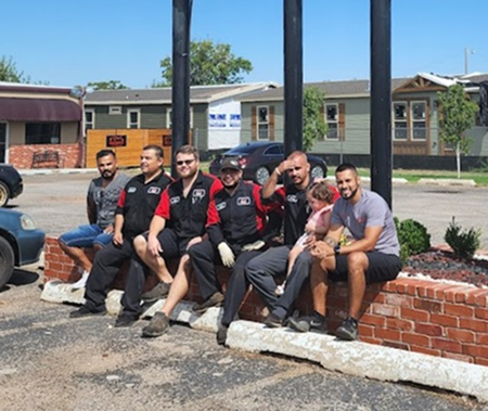 Our Expert Staff under sign | Innovative Auto Service