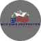Logo of McComis Properties, a veteran-owned real estate company, with a house silhouette and American flag design.