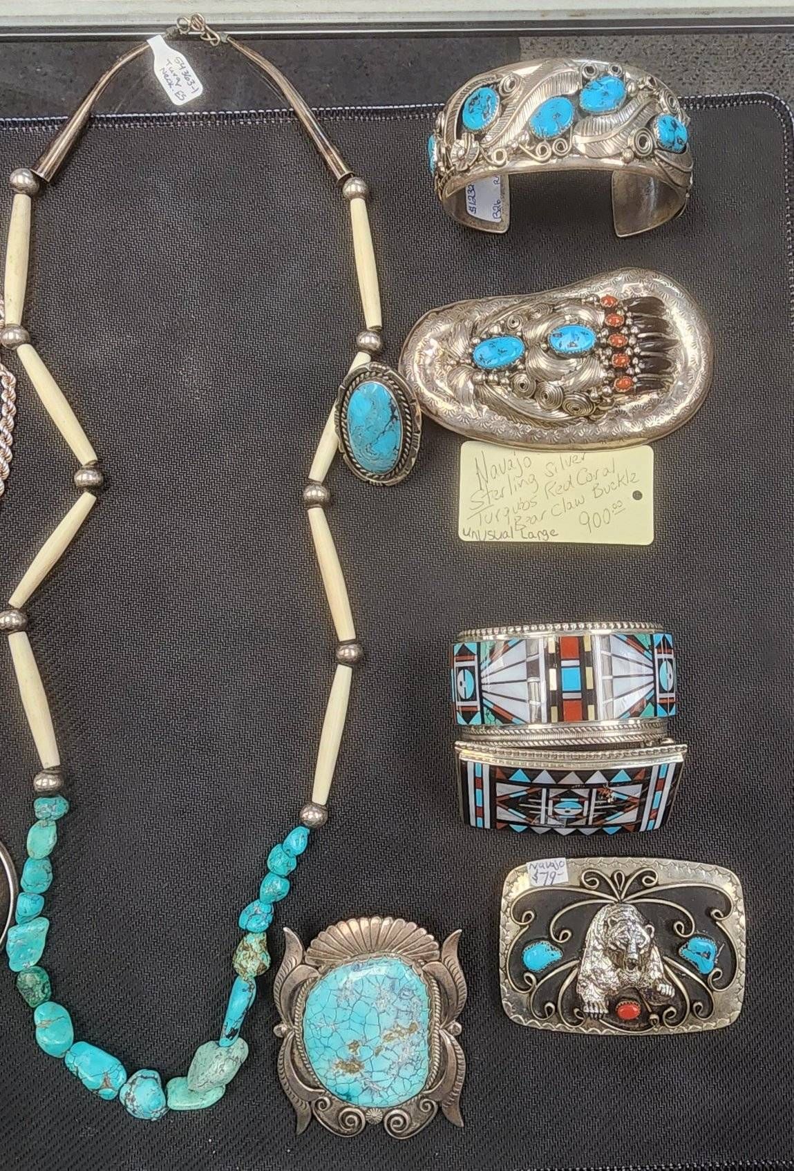 A collection of native american jewelry including a necklace and bracelets