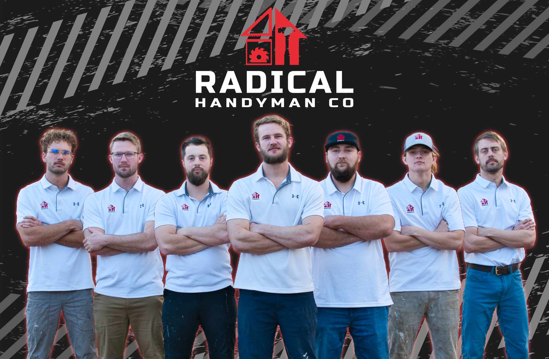 A group of men standing next to each other with their arms crossed.