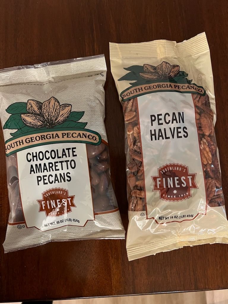 Image of plain, praline, and chocolate amaretto pecans.