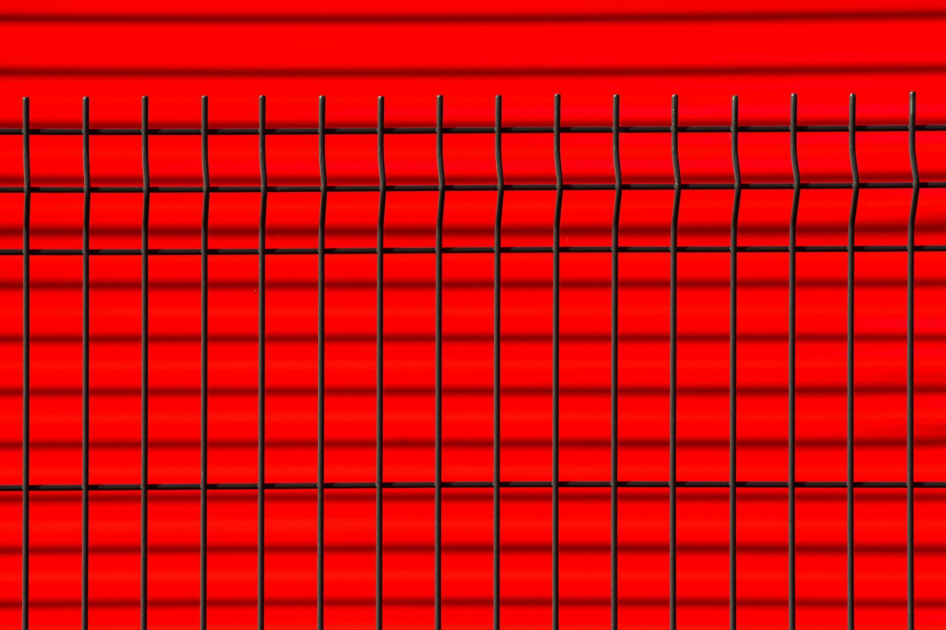 A close up of a red grid on a red background.