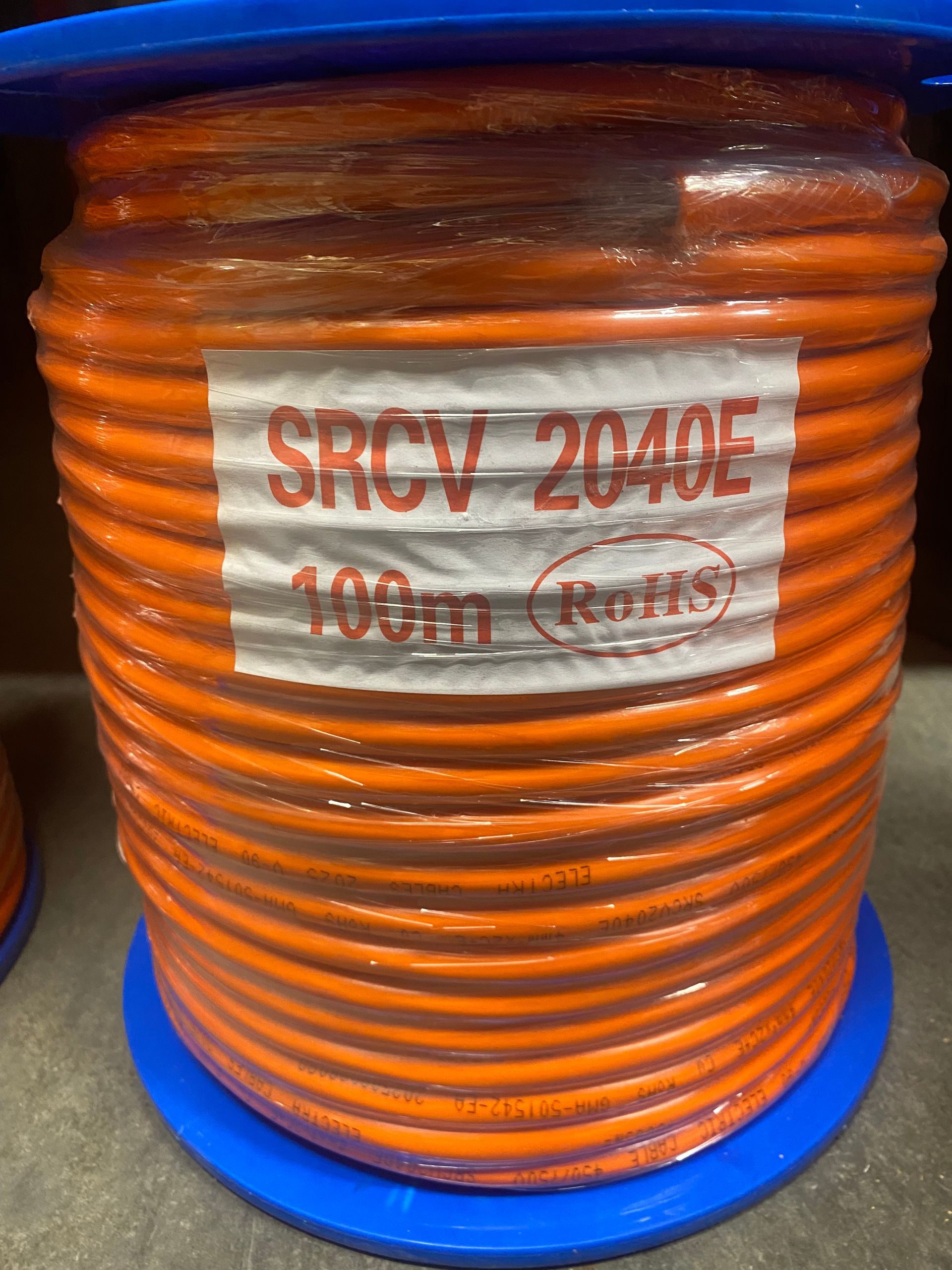 Multimeter displaying 0.0, colorful wires, and electrical schematic on a white surface.