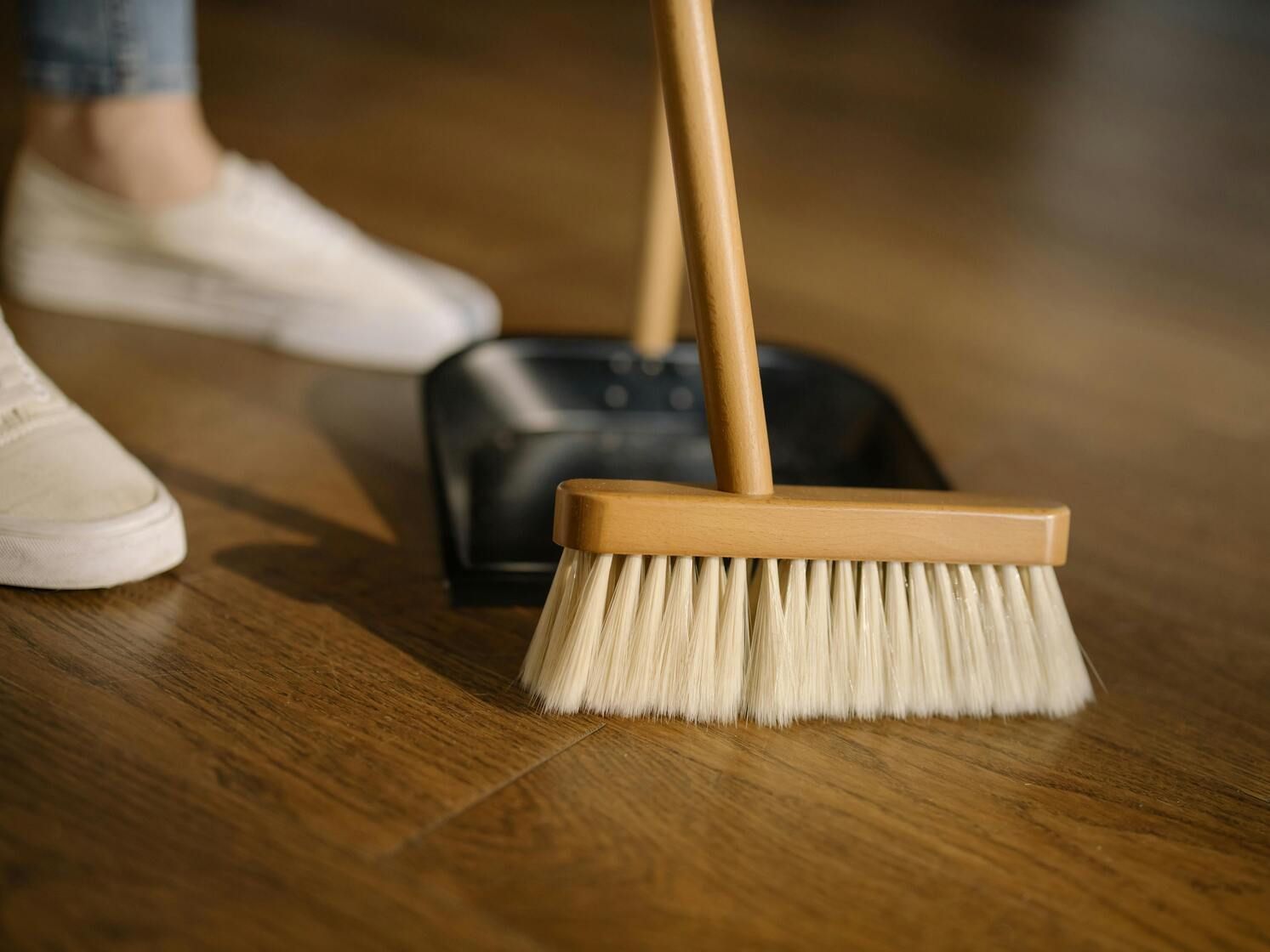 Sweeping the floor by a professional cleaner