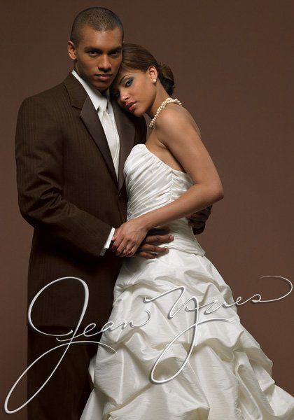 man in brown suit with woman