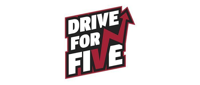 A logo for drive for five with an arrow pointing up.