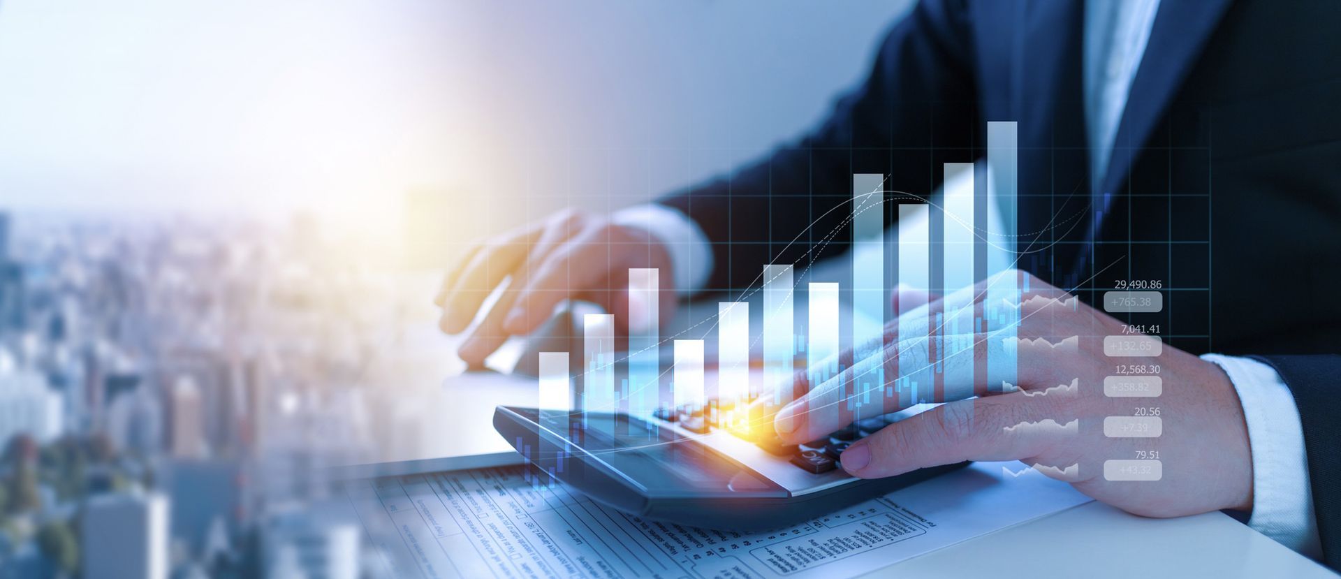 A man in a suit is using a tablet with a graph on it.