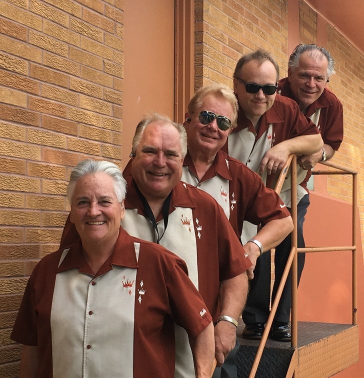 The White Sidewalls are standing on a set of stairs