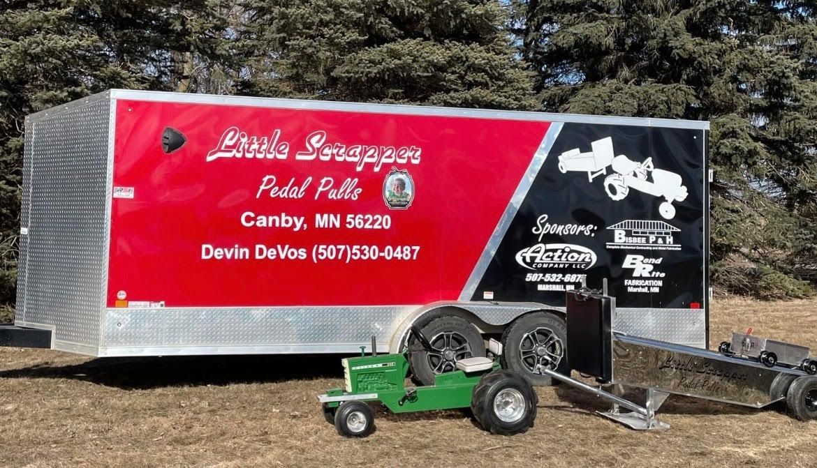 A trailer in black and red, promoting Little Snappers Pedal Pulling with contact info and local business sponsorships.