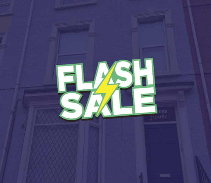 Flash Sale graphic over a blue building facade.