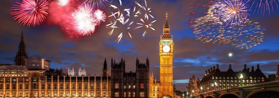 Fireworks over the Houses of Parliament and Big Ben in London at night.